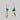 Earring With Sliced Cowrie And Dark Blue Stone