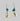Earring With Sliced Cowrie And Dark Blue Stone